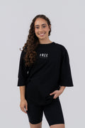 FREE Oversized T-Shirt Black - front on model