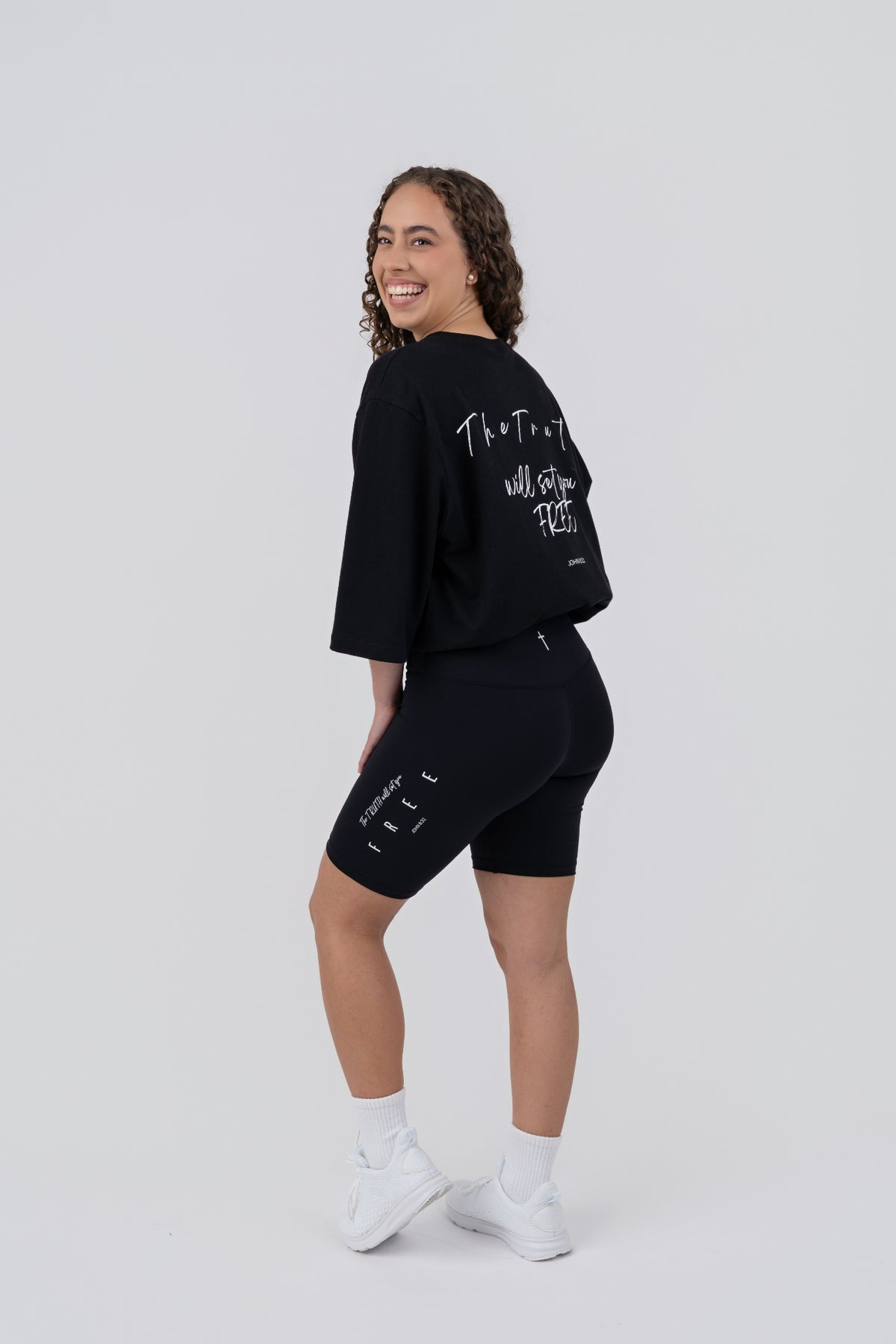 FREE 8" Bike Shorts - back three quarter with black tee